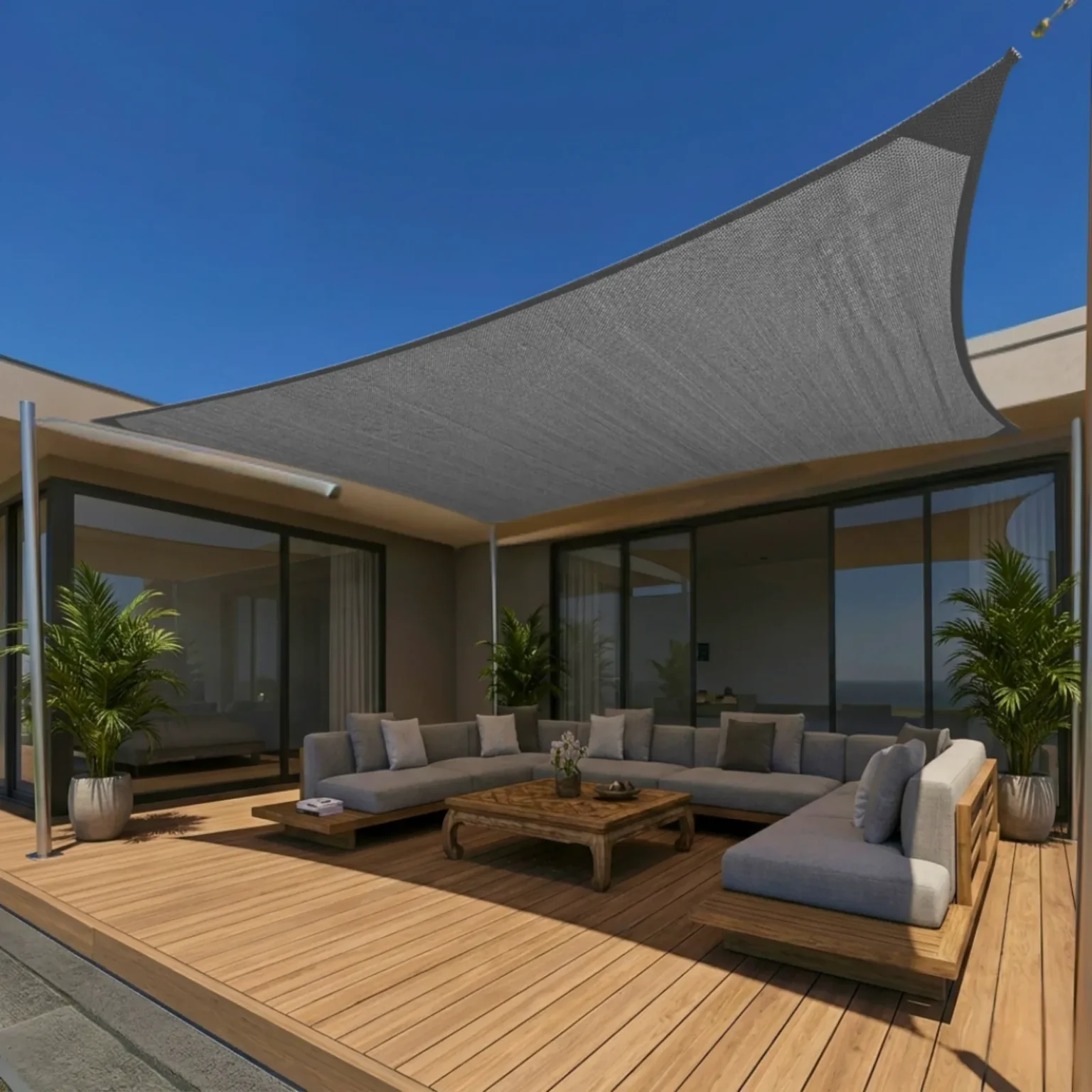 Voile d'ombrage grise moderne tendue au-dessus d'une terrasse lounge à La Réunion